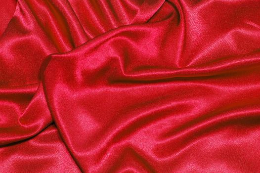 red satin or silk background with textile texture