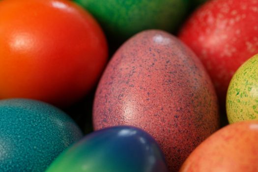 Macro image of painted Easter eggs.  Shallow depth of field focusing on the middle egg.
