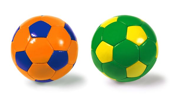 Photograph of two isolated soccer balls - different colour combinations.  Clipping paths included.
