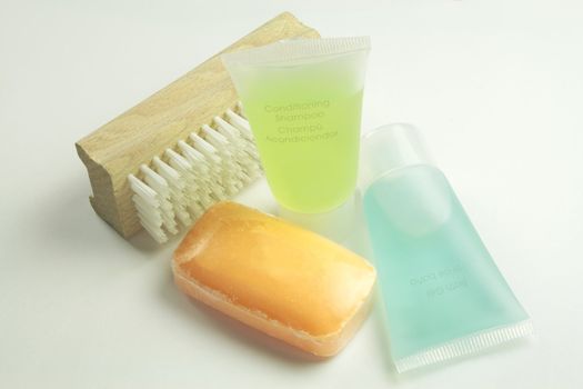 small size toiletries for travelling shown against a nailbrush