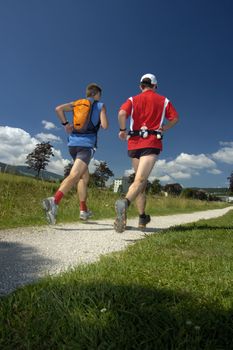 Two runners in the final stages of the Swiss Jura Marathon 2006