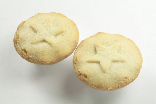 two small mincepies  over a white background