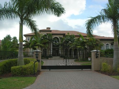   Mediterranean House with pavers, iron gate and lanscaping in miami florida        