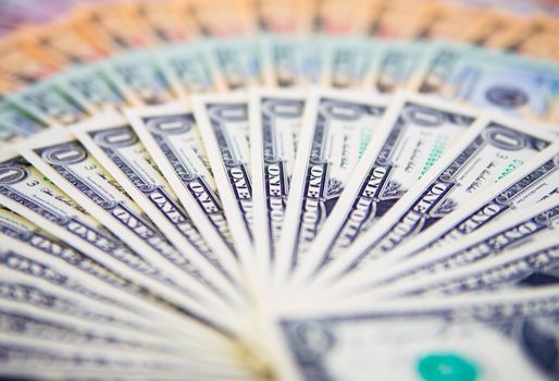 US banknotes on a fan of high-denomination european euro notes