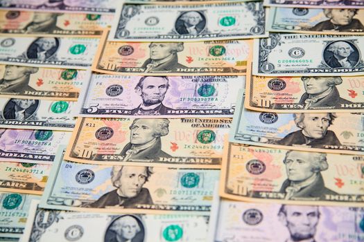 US banknotes on a fan of high-denomination european euro notes