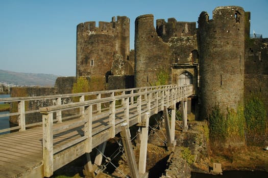 Caerphilly castle in spring with bridge, horizontally framed shot