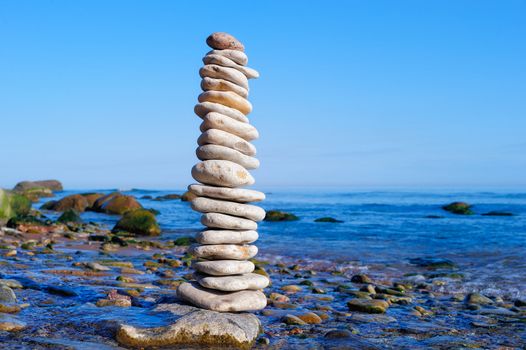 Stack of the white pebble on the seashore