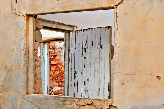 look through the window and the door in the ruins