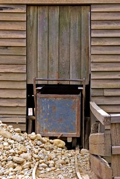 an old mine cart is blocked by rocks and rubble