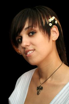 The young beautiful girl with flowers, isolated on a black background