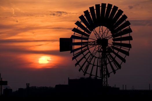 Windmill against setting Sun