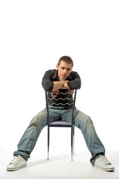 The thoughtful young man on a chair