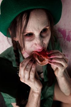 female zombie or alien scout chewing on tasty human ear