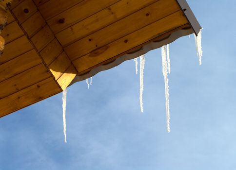 Icicles on a roof of the country house.