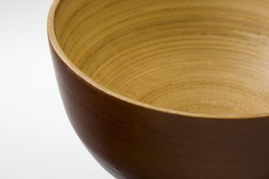 empty, round, wooden bowl with white copy space