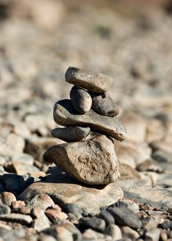 a small of rocks balancing in a pileor tower