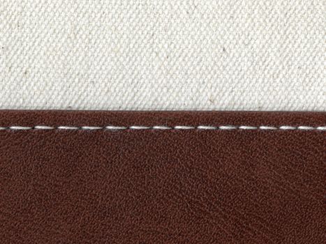 two textile materials jointed by white thread