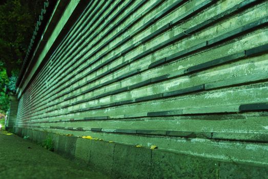 old style boundary wall around Japanese Temple in Tokyo, Japan;
focus on front part with yellow leafs