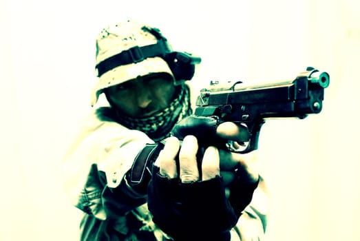an image with a soldier pointing with his gun