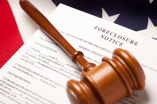 Gavel, American Flag and Foreclosure Notice with Selective Focus.