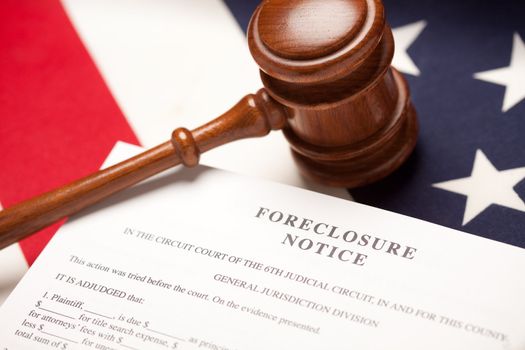 Gavel, American Flag and Foreclosure Notice with Selective Focus.