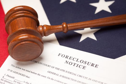 Gavel, American Flag and Foreclosure Notice with Selective Focus.