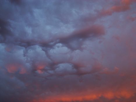 Cumulus clouds in the dark blue sky