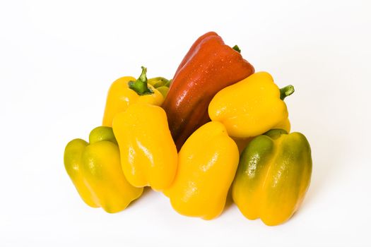 Some different paprika fruits on a white background