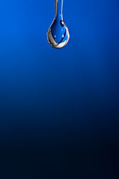 Water drop on blue background