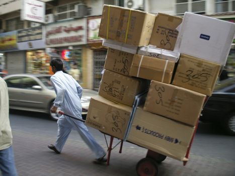 Man transporting card board boxes