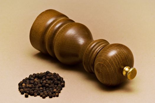 Pepper-mill and black pepper grains