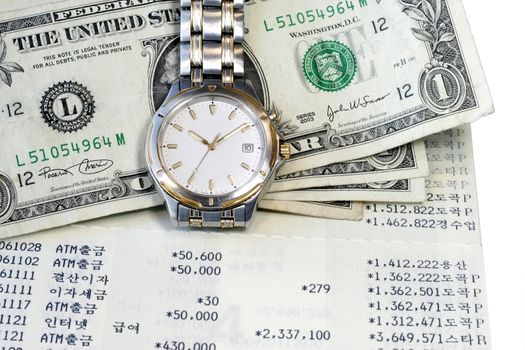 US Dollar wristwatch and passbook page portray  Time and Money