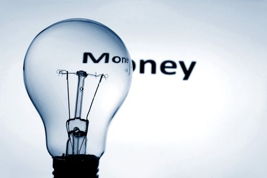 bulb and money text showing concept of financial success