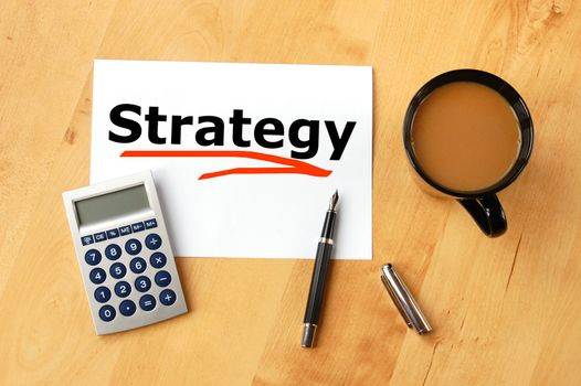 business or investment strategy concept with pen paper and coffee in office
