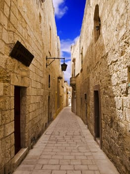 A medieval limestone paved street in Mdina on the island of Malta