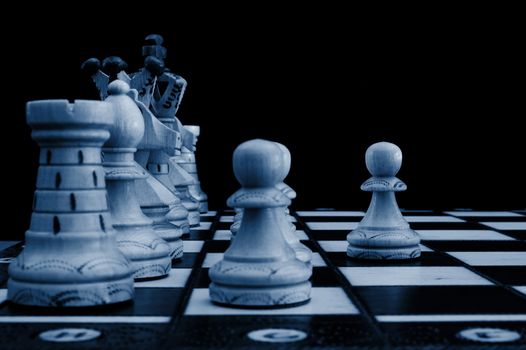 chess pieces showing concept of conflict power and success
