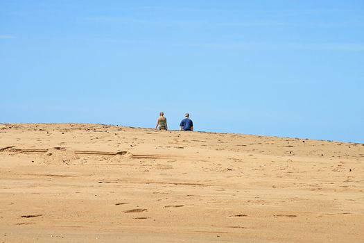 Couple Disappearing over Sandy Rise