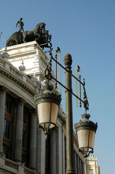 historical madrid building with historical street lamp