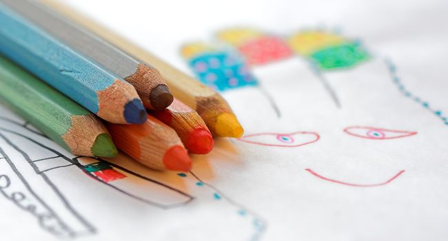 Stack of color crayons close up