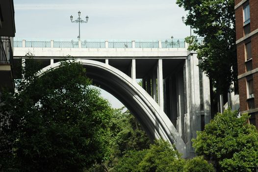 high madrid bridge with trees and blue sky