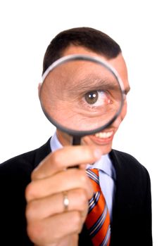 business man with a loupe over white background