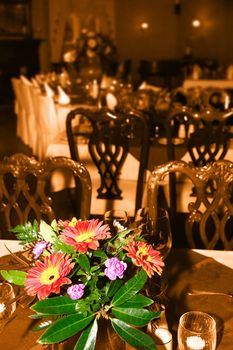 a romantic setting for a lovely meal out in sepia and the flowers in color