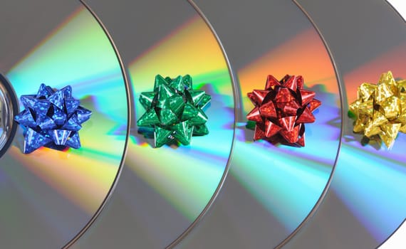 Disks with multicolored bows lay abreast