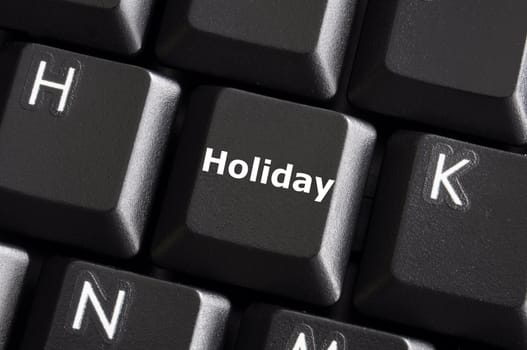 holiday concept with button on computer keyboard