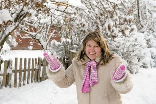 Happy middle-aged women having fun on winters day.