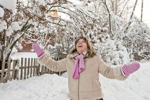 Happy middle-aged women having fun on winters day.