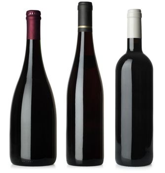 Three merged photographs of different shape red wine bottles.  Separate clipping paths for each bottle included.