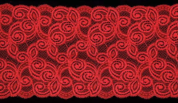 red  lace on black background                             