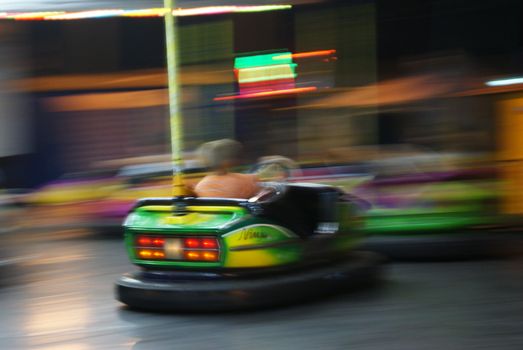 	Auto scooter carousel, in motion blur