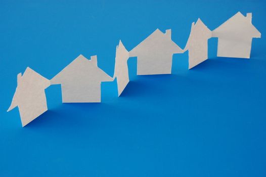 paper houses or homes showing a concept for real estate